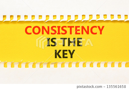 Consistency is the key symbol. Concept words Consistency is the key on beautiful yellow paper. Beautiful white paper background. Business consistency is the key concept. Copy space. Consistency is the key symbol. Concept words Consistency is the key on beautiful yellow paper. Beautiful white paper background. Business consistency is the key concept. Copy space. 135561658