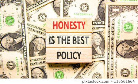 Honesty is the best policy symbol. Concept words Honesty is the best policy on beautiful wooden blocks. Beautiful dollar bills background. Business honesty is the best policy concept. Copy space. 135561664