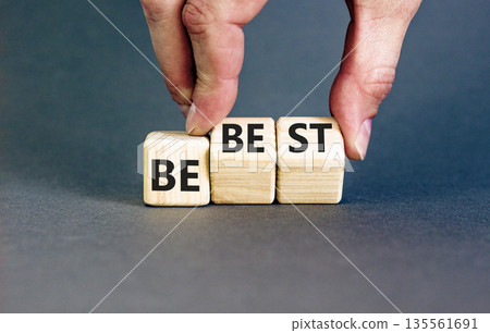 Motivational and inspirational be best symbol. Concept words Be best on beautiful wooden block. Beautiful grey background Businessman hand. Business motivational be best concept. Copy space. Motivational and inspirational be best symbol. Concept words Be best on beautiful wooden block. Beautiful grey background Businessman hand. Business motivational be best concept. Copy space. 135561691
