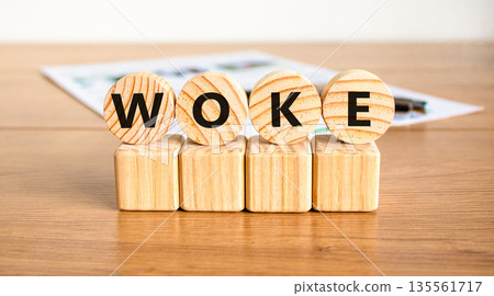 Woke question symbol. Concept word Woke question on beautiful wooden circles on wooden blocks. Beautiful wooden table white background. Business, lifestyle, support woke question concept. Copy space. Woke question symbol. Concept word Woke question on beautiful wooden circles on wooden blocks. Beautiful wooden table white background. Business, lifestyle, support woke question concept. Copy space. 135561717