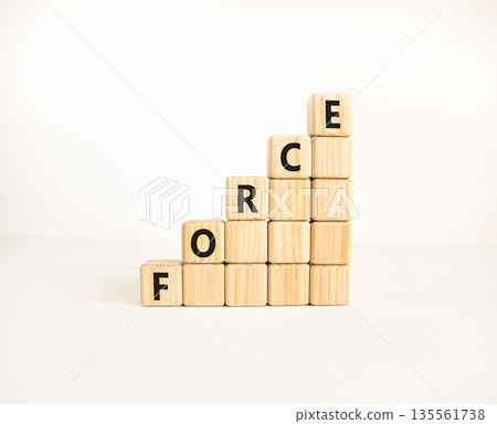Force symbol. Concept word Force on beautiful wooden blocks. Beautiful white table white background. Business lifestyle force concept. Copy space. 135561738