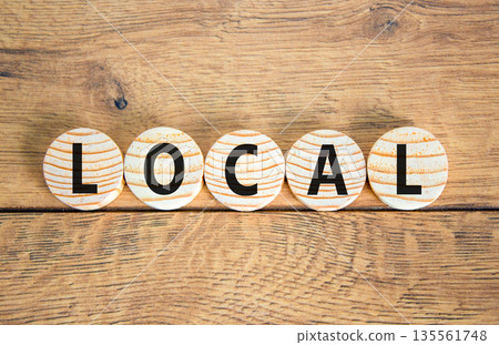 Local symbol. Concept word Local on beautiful wooden circles. Beautiful wooden table wooden background. Business lifestyle local concept. Copy space. 135561748
