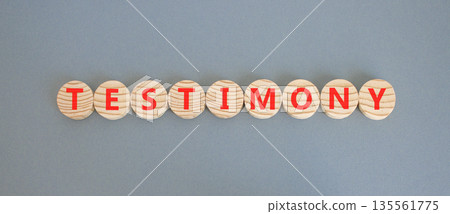 Testimony symbol. Concept word Testimony on beautiful wooden circles. Beautiful grey background. Business education support testimony concept. Copy space. Testimony symbol. Concept word Testimony on beautiful wooden circles. Beautiful grey background. Business education support testimony concept. Copy space. 135561775