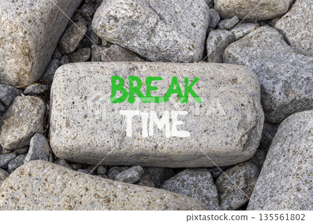 Break time symbol. Concept word Break time on beautiful grey stone on stone beach. Beautiful grey stone beach background. Business break time concept. Copy space. 135561802