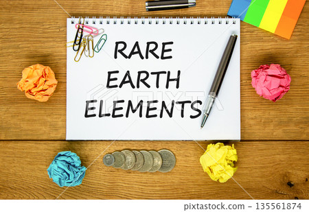 Rare earth elements symbol. Concept words Rare earth elements on beautiful white note. Black pen. Colored paper. Beautiful wooden background. Business and rare earth elements concept. Copy space. 135561874