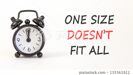 One size does not fit all symbol. Concept words One size does not fit all on beautiful white paper. Beautiful white background. Alarm clock. Business one size does not fit all concept. Copy space. 135561912