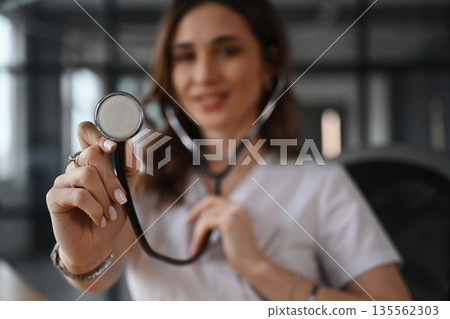 Professional stethoscope. Woman doctor is in the office Professional stethoscope. Woman doctor is in the office 135562303