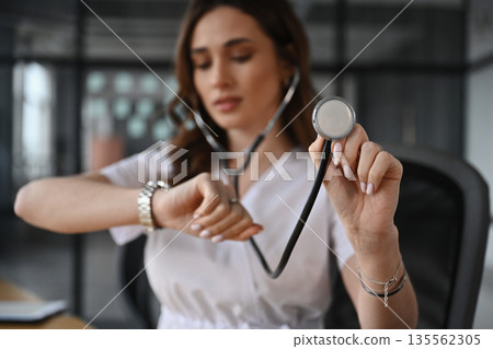 Professional stethoscope. Woman doctor is in the office Professional stethoscope. Woman doctor is in the office 135562305