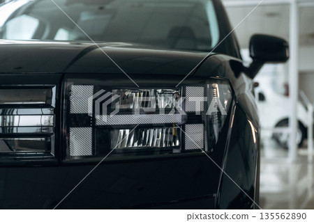 Particle front view of modern car in dealership 135562890
