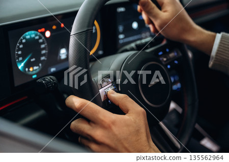Man is sitting in car, detailed view Man is sitting in car, detailed view 135562964
