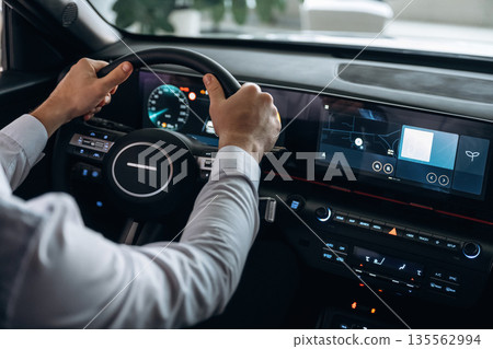 View from behind. Man is sitting in car, detailed view View from behind. Man is sitting in car, detailed view 135562994
