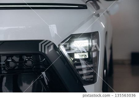 Parked in dealership. Particle front view of modern car 135563036