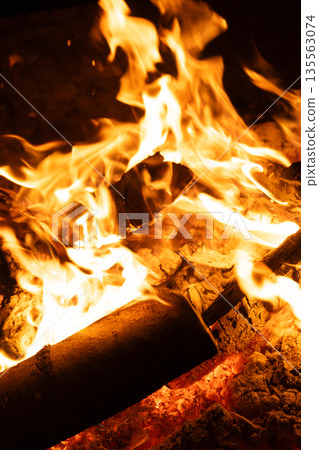 Background of Firewood Heating up with Bright Flames. 135563074