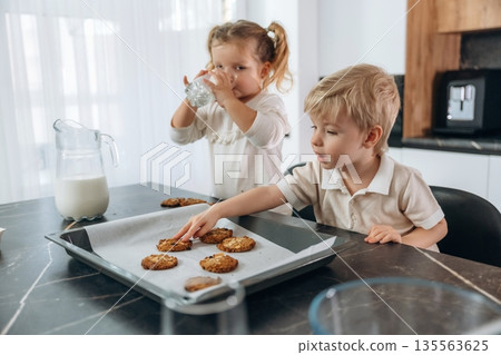 Kids are preparing bakery at home Kids are preparing bakery at home 135563625