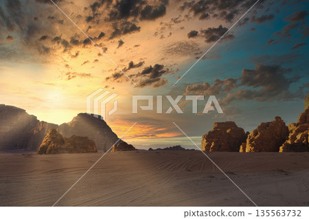 Sunset over rocky landscape setting with clouds on sky. Wadi Rum desert, Jordan, The Valley of Moon 135563732