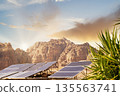 Solar panels on mountain landscape at sunset in a desert location with clear skies. Petra, Jordan. 135563741