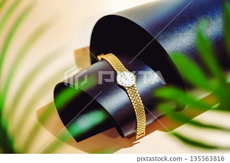 Golden wrist watch 135563816