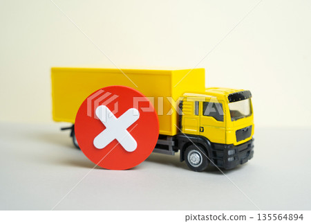 A truck and a cancellation or prohibition sign. Restrictions on the entry of trucks. Transport regulation concept, access limits, urban policy and impact on logistics and supply chains. A truck and a cancellation or prohibition sign. Restrictions on the entry of trucks. Transport regulation concept, access limits, urban policy and impact on logistics and supply chains. 135564894