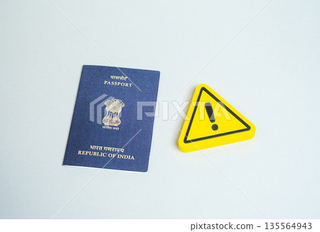 Passport of the Republic of India and caution sign. Temporary residence permit. Changes in legislation and border crossing regulations. Tightening of rules for obtaining a passport or citizenship. Passport of the Republic of India and caution sign. Temporary residence permit. Changes in legislation and border crossing regulations. Tightening of rules for obtaining a passport or citizenship. 135564943