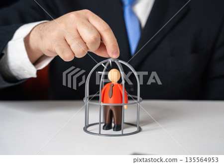 Caging an office worker. Penalties and increased oversight. Workers' rights. Symbol of excessive control and pressure. Labor law balance, ethical management Caging an office worker. Penalties and increased oversight. Workers' rights. Symbol of excessive control and pressure. Labor law balance, ethical management 135564953