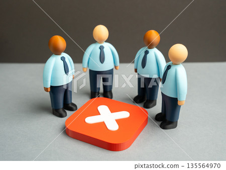 Office workers stand over a cancellation sign. Failure to reach an agreement, refusal to cooperate. Project failure. Breakdown of negotiations, misalignment and consequences for teamwork and results Office workers stand over a cancellation sign. Failure to reach an agreement, refusal to cooperate. Project failure. Breakdown of negotiations, misalignment and consequences for teamwork and results 135564970
