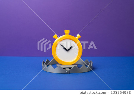 The stopwatch is trapped. Time until it slams shut. The deadline is approaching and the end is near. Urgency and pressure concept, last chance moment, countdown stress and critical decision point 135564988