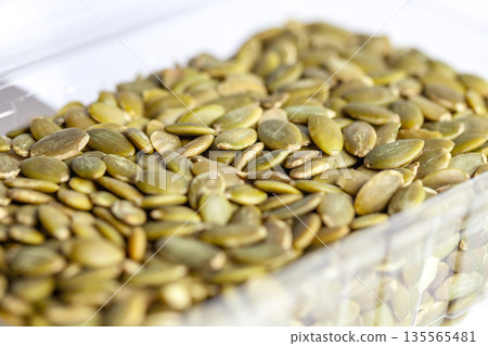 Pumpkin seeds isolated on white background. food 135565481