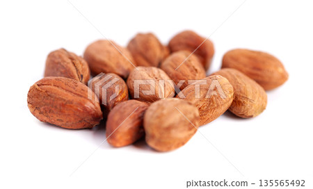 Hazelnuts kernels on a white background, healthy food. Macro Hazelnuts kernels on a white background, healthy food. Macro 135565492