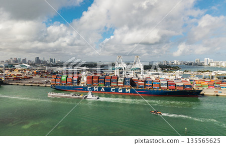 Miami, Florida - February 12, 2025: Export and import. Port of Miami. Cargo ship loaded with container in Miami, aerial. Freight container. Aerial Miami port with cargo container. Cargo handling 135565625