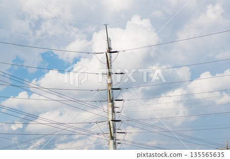 Electricity power lines and sky. Green energy. Electric voltage station. High voltage. Electricity power pylon. Electricity tower. Electrical energy. Power transmission tower 135565635