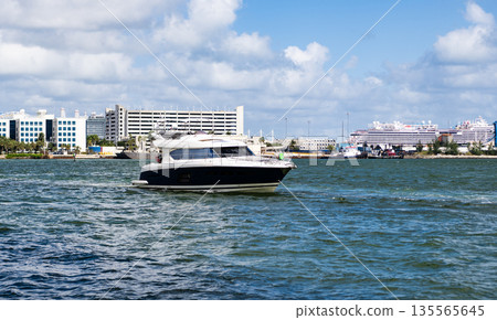 Motorboat yacht sailing at sea. Charter motorboat. Luxury boat motor yacht at sea. Yachting boat tourism. Luxury lifestyle. Vacation on summer. Yacht at sea. Relax on the boat Motorboat yacht sailing at sea. Charter motorboat. Luxury boat motor yacht at sea. Yachting boat tourism. Luxury lifestyle. Vacation on summer. Yacht at sea. Relax on the boat 135565645