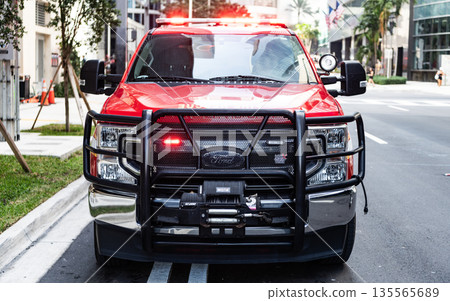 Miami, Florida, USA - December 01, 2024: Fire rescue in city of Miami. Big fire car outdoor. Fire vehicle of Ford F 250, front view. Ford F 250 fire car 135565689