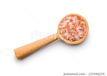 Pink Himalayan salt on wooden spoon isolated on white background. Pink Himalayan salt on wooden spoon isolated on white background. 135566270