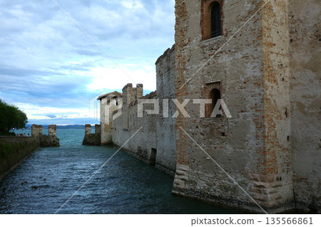 Sirmione town by Lake Garda under summer sky Sirmione town by Lake Garda under summer sky 135566861