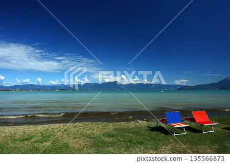 Sirmione town by Lake Garda under summer sky Sirmione town by Lake Garda under summer sky 135566873