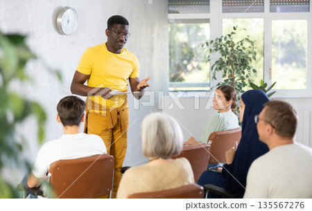 African american tutor giving lecture to group of adult students African american tutor giving lecture to group of adult students 135567276