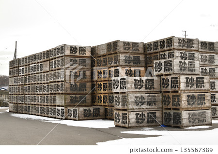 Photographing the scenery of stacked containers at Sunahara Fishing Port in Morimachi, Hokkaido in winter 135567389