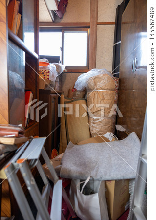 A storeroom in an old house overflowing with things A storeroom in an old house overflowing with things 135567489