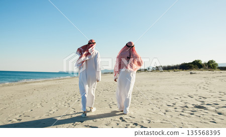 Two Sheiks Taking A Walk To Discuss About Business 135568395
