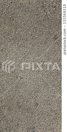 Asphalt texture background in the evening light | Warm pavement surface texture 135569319