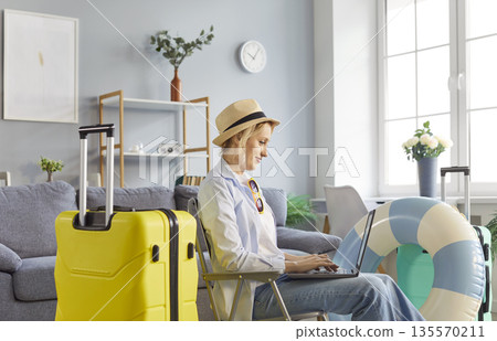Happy Woman Booking Summer Vacation Online 135570211