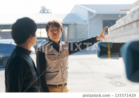 Men working in a lumber mill 135571429
