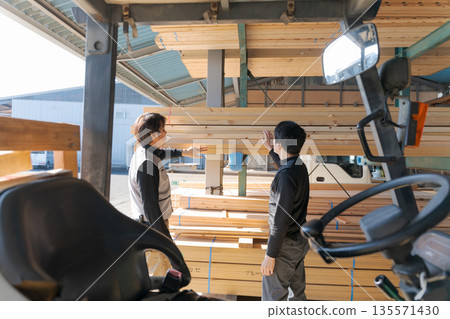 Men working in a lumber mill Men working in a lumber mill 135571430