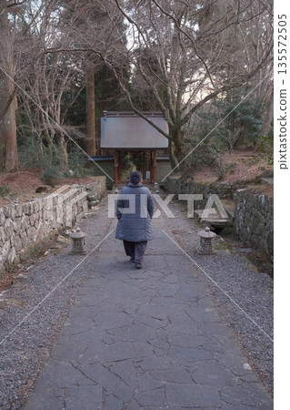 A woman visiting at a shrine 135572505