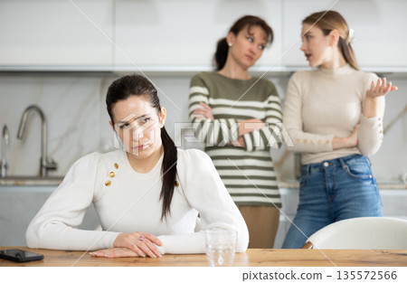 Two sisters during family quarrel accuse woman Two sisters during family quarrel accuse woman 135572566