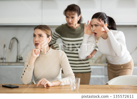 Two sisters during family quarrel accuse woman 135572611
