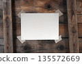 Blank Paper Sheet with Adhesive Tape on Old Wooden Rustic Planks Surface. File with Clipping Path. 135572669