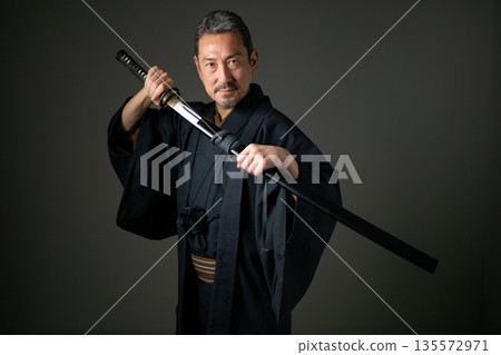 A man wearing a kimono 135572971