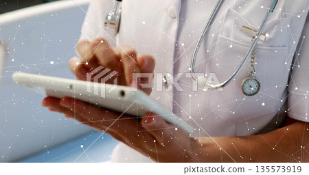 Tapping nurse in scrubs using tablet in clinic, stethoscope, watch, network overlay, copy space Tapping nurse in scrubs using tablet in clinic, stethoscope, watch, network overlay, copy space 135573919