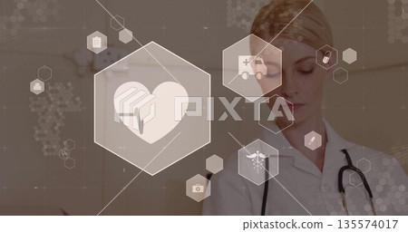 Female doctor in lab coat standing in clinic, with stethoscope and medical icons, copy space 135574017